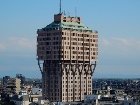 Milan, Lombardy, Italy - April 27, 2016: Velasca Tower, a skyscraper built in 1958 and became one of the landmarks of Milan, view from the terrace of the cathedral