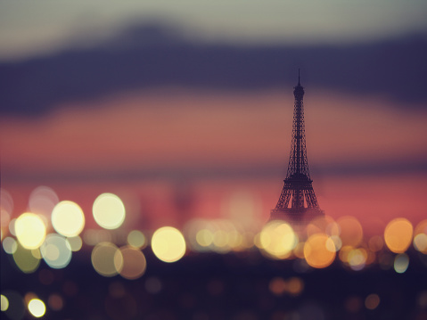 Silhouette of Eiffel tower and night lights of Paris, France
