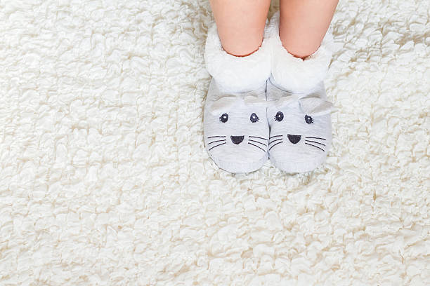 istock Child. Child's feet in slippers. 526848578