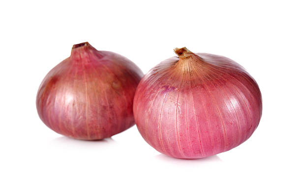 istock unpeeled whole red onion, shallots on white background 526848786