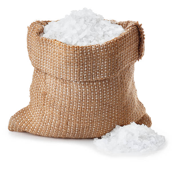 Sea salt in sack isolated on white stock photo