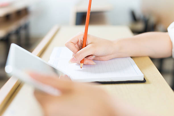 istock young beautiful asian girl student in classroom 526850480