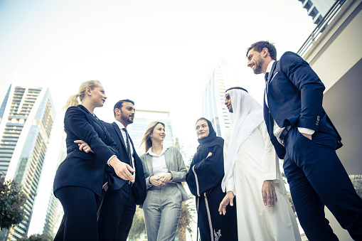Middle Eastern Business Tycoons Talking about business prospects in Dubai with Foreign Expats.