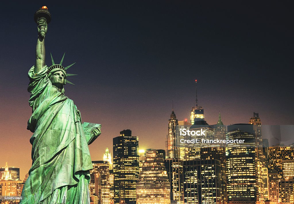 Statue of Liberty and New York City skyline Night Stock Photo