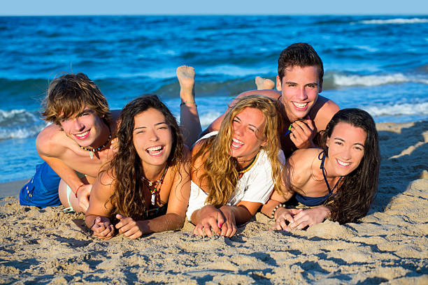 istock Boys and girls group having fun on the beach 526854851