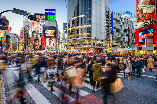 Tokyo, Japan - December 24, 2012: Pedestrians cross at Shibuya Crossing. The scramble crosswalk is one of the busiest in the world.