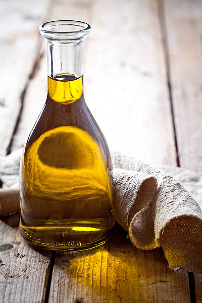 istock fresh olive oil in bottle 526857143