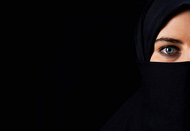 istock Arab woman with black veil 526857419