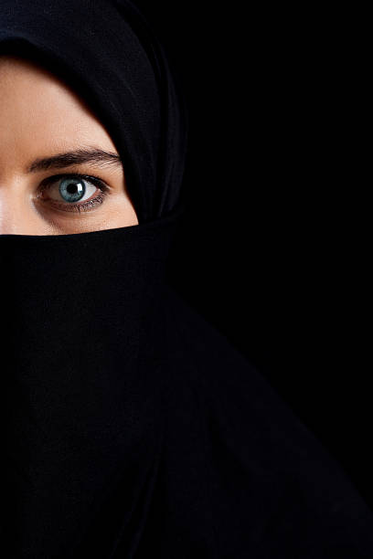 istock Muslim woman wearing black veil 526857427
