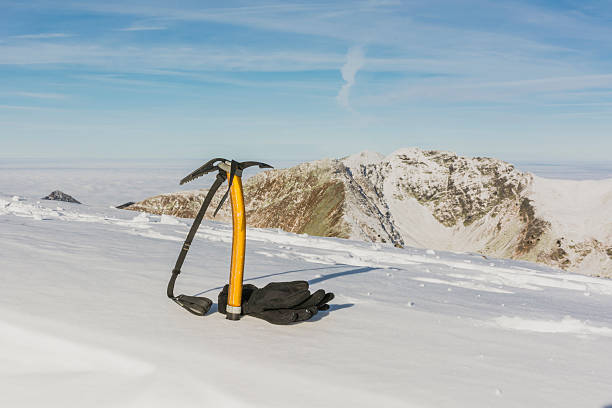 istock Gloves and Ice axe in the mountains 526857847