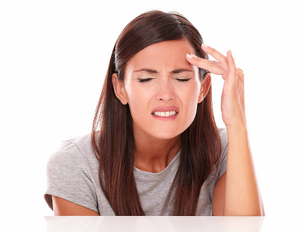 istock Young woman in pain with closed eyes 526858559