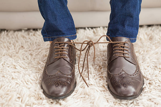istock Classy mans shoelaces tied together 526858635