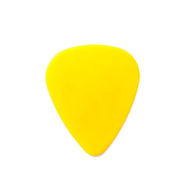 istock yellow guitar pick isolated on white 526858897