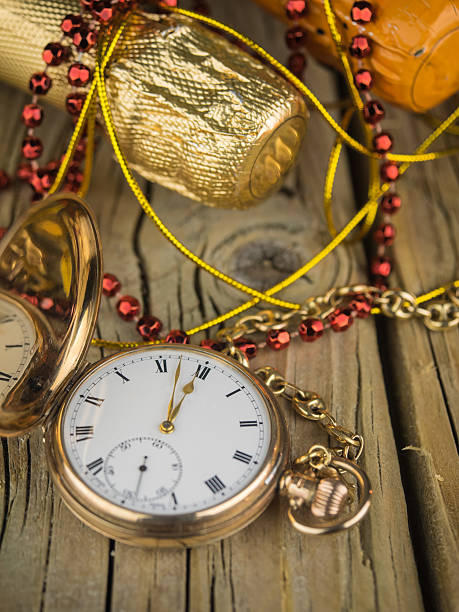 istock pocket watch and champagne bottles 526860379