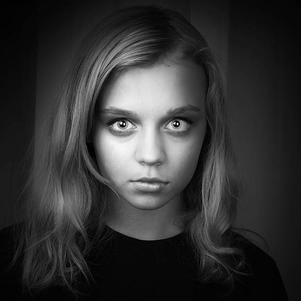 istock Serious blond Caucasian girl with mysterious look 526860455