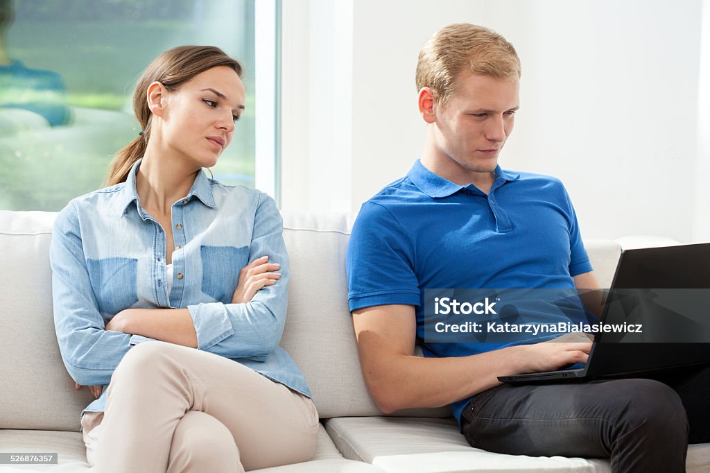 Man surfing woman looking A man using a laptop and a womand secretly looking Adult Stock Photo