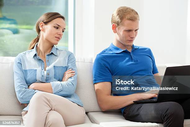 Man Surfing Woman Looking Stock Photo - Download Image Now - Adult, Apartment, Blond Hair