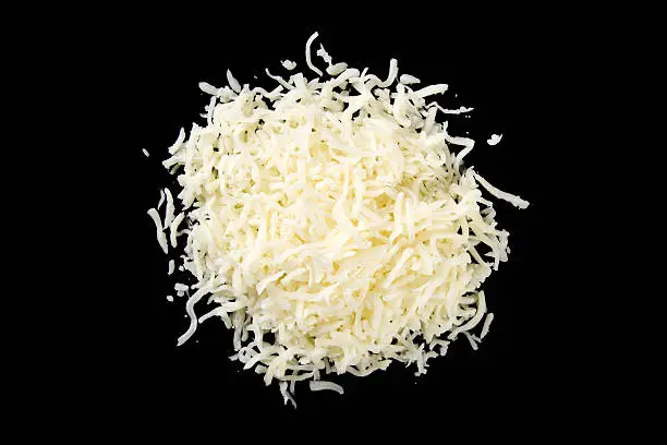 A mount of mozzarella cheese on a black background