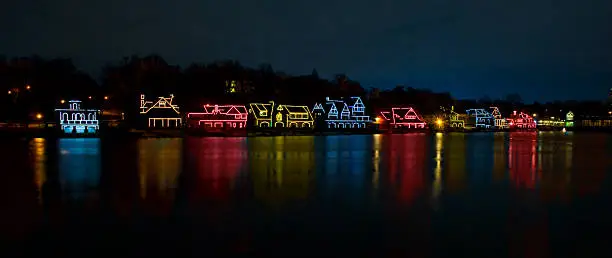 Christmas lights reflecting in water on lake