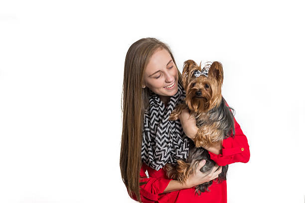 istock Girl with pet dog on white 526879033