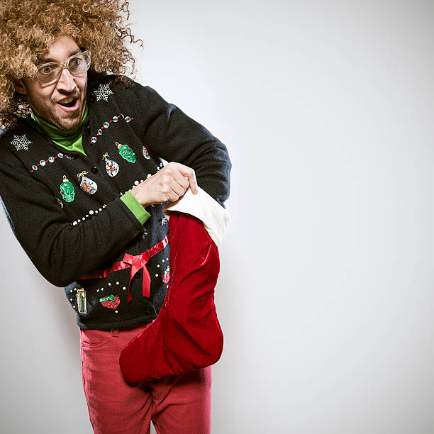 istock Christmas Sweater Man with Stocking 526881567