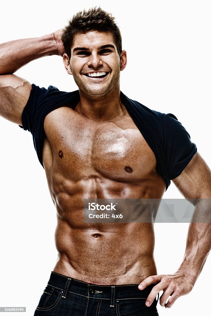 Muscular man looking at camera Muscular man looking at camerahttp://www.twodozendesign.info/i/1.png 20-29 Years Stock Photo