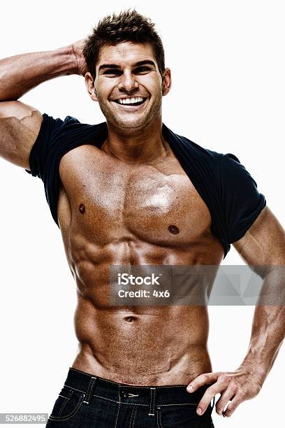 Muscular Man Looking At Camera Stock Photo - Download Image Now - 20-29 Years, Abdominal Muscle, Adult