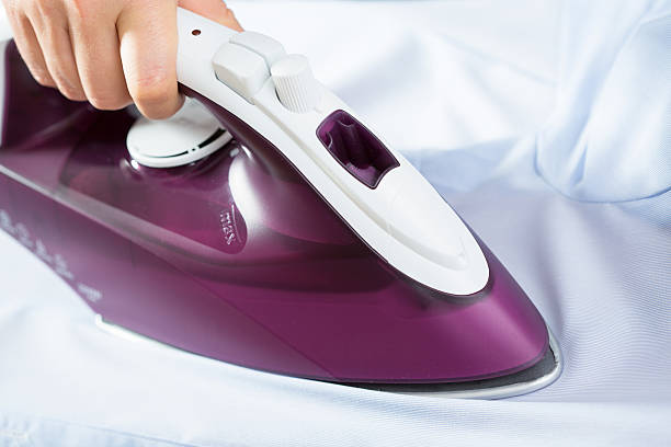 istock Close-up of ironing shirt 526883691