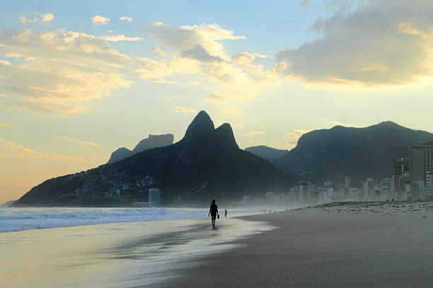 istock Woman walking in Ipanema beach 526896951