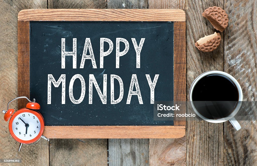 Happy monday sign Happy monday sign on blackboard with cup of coffee ,cookie and clock on wooden background Backgrounds Stock Photo