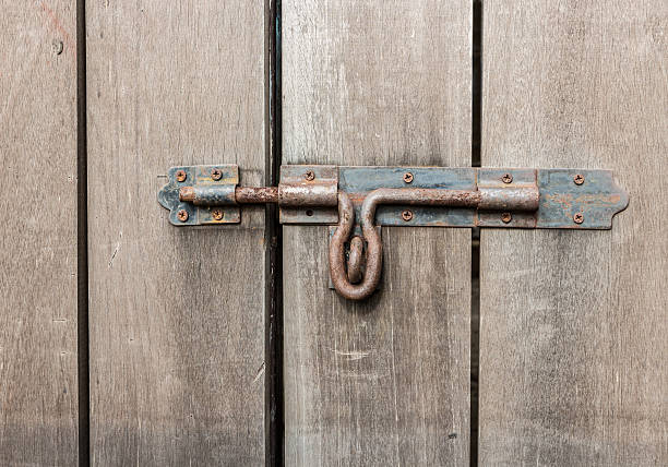 istock old wood door and rusty safe lock 526900673