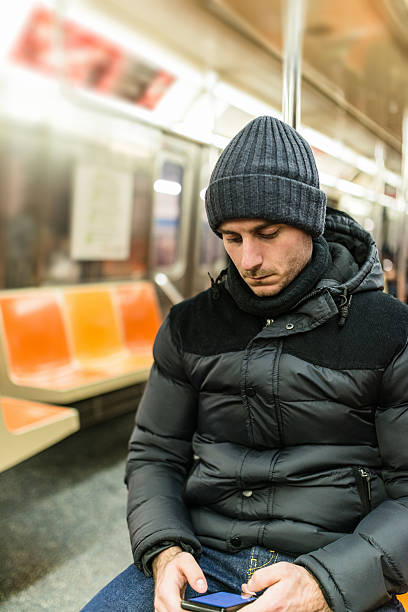 istock caucasian pensive man with knit hat on the metro 526901361
