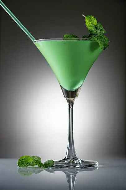 Grasshopper cocktail with mint on gradient background