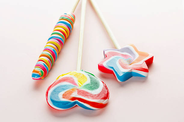 istock Three Colorful Swirl Lollipops 526916675