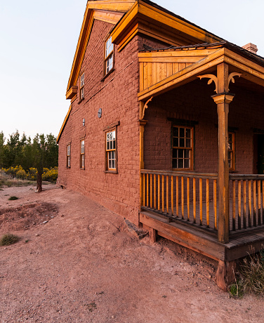 USA, State of Utah, Washington County, town of Grafton. The Alonzo H. Russel home (about 1862). Grafton is a ghost town near the Zion National Park. The site was first settled in December 1859 as part of a cotton-growing project ordered by Brigham Young (president of the Church of Jesus Christ of Latter-day Saints from 1847 to 1877). After a  flood of the Virgin River, that had destroyed the first town (called Wheeler), a new town, called New Grafton, was built upstream. In 1866 some settlers were killed by Navajo raiders. Besides that, more than thirty people (including many children) died of diseases such as diphtheria, scarlet fever, or accident. So a lot of Grafton's residents moved to Rockville. In 1890 only four families remained. In 1921, the local branch of the Church of Jesus Christ of Latter-day Saints was discontinued. Grafton was permanently abandoned in 1944. In 1997, a restoration project started to preserve the Grafton site. The old church, some houses, and the fence of Berry's grave in the cemetery were restored. In the cemetery it's believed about 80 graves exist. In the center of the cemetery there is the restored fence of Robert Madison Berry (24 years old), his wife Mary Isabella Hales Berry (20) and his brother Joseph Smith Berry (22), killed by Indians. Grafton has been featured as a location in several films.