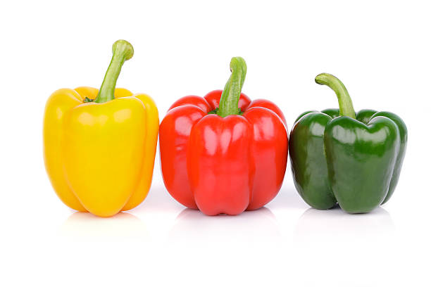 istock bell peppers or capsicum isolated on white background 526919781