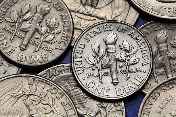 Coins of USA. US dime Coins of USA. Torch, oak branch and olive branch depicted on the US dime coin. ten cents stock pictures, royalty-free photos & images