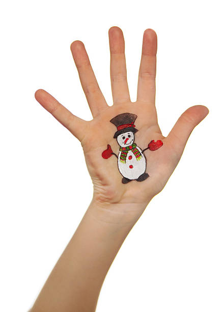 istock Kid's hands with painted Christmas symbol 526920853