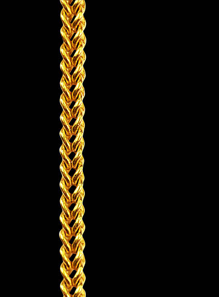 istock Gold chain necklace isolated on black, closeup , clipping path 526921481