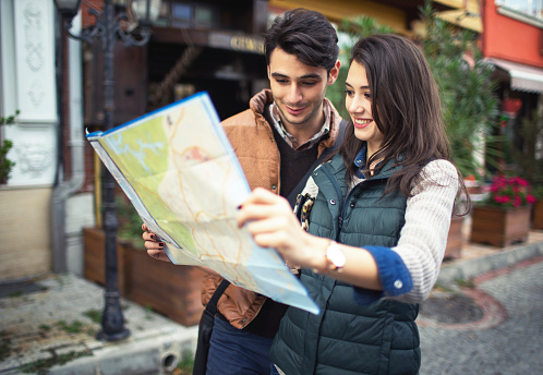 Turkish couple using paper map.