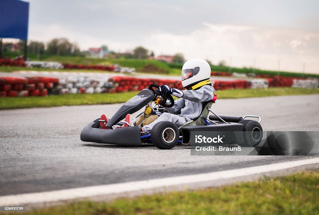 Go-carting. Man driving go-cart on a sports track. Go-cart Stock Photo