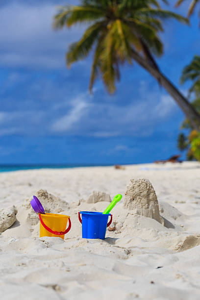 istock kids toys on sand beach 526932085