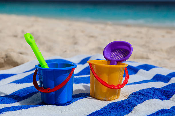 istock kids toys on sand beach 526932087
