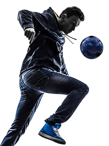 istock young man soccer freestyler player silhouette 526932863
