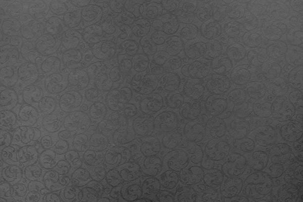 istock paper of pale black color with openwork texture 526933405