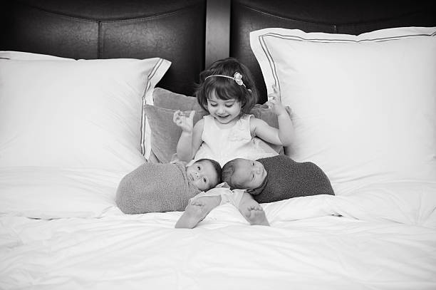 Newborn identical twins snuggle in their bassinet.  Read about this shot in my blog....Other related images (click on image to view):