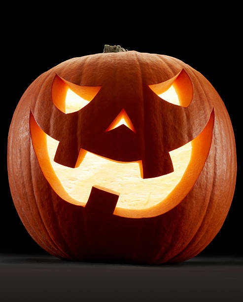 istock Halloween orange pumpkin, Jack O'Lantern on black 526942837