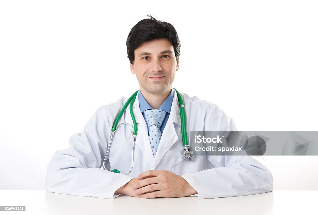 Male doctor Male doctor at the desk isolated on a white background Adult Stock Photo