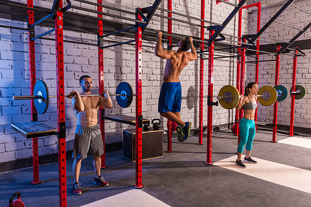 istock Barbell weight lifting group weightlifting at gym 526944471