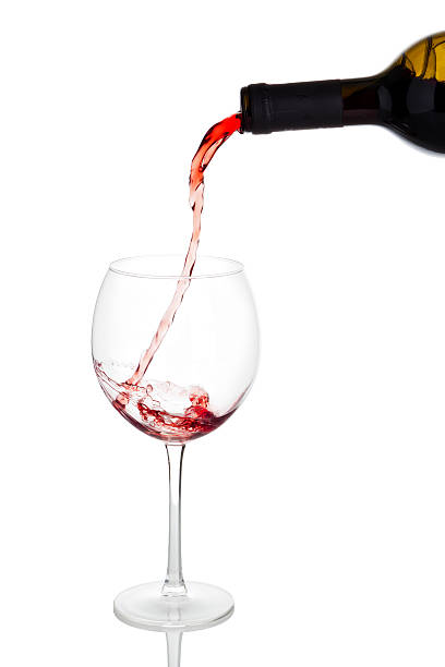 istock Pouring red wine into glass 526945181